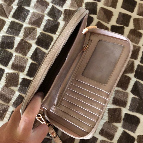 A rose gold metallic Michael Kors wristlet. - Picture 2 of 2